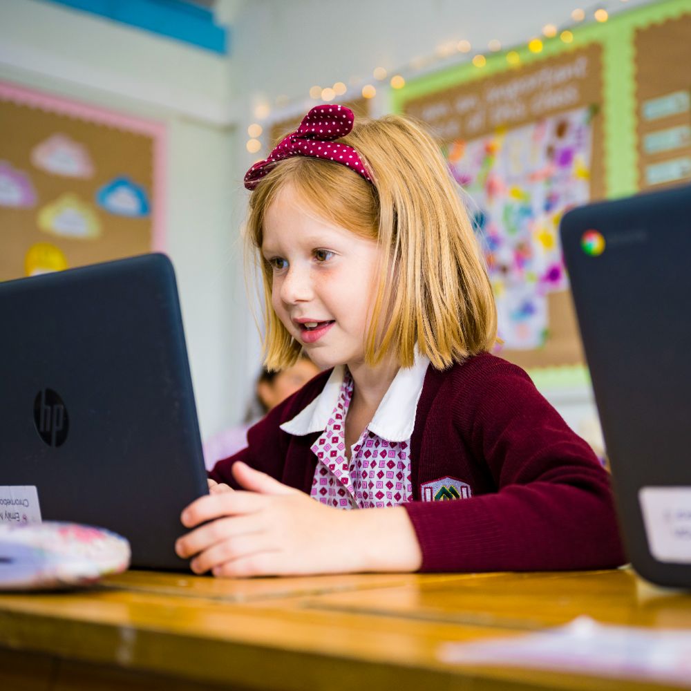 photo of claires court junior girl pupil in class