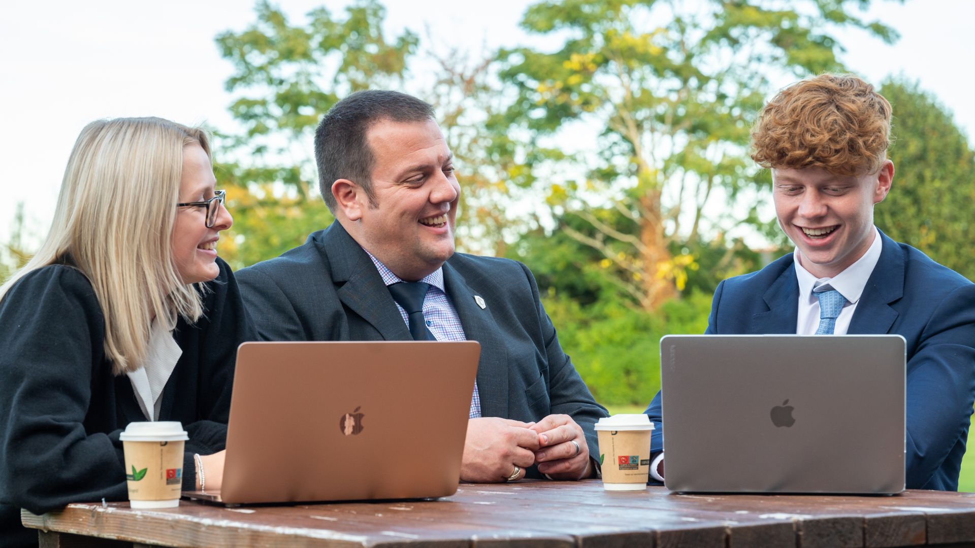 photo of sixth former sat outside with Gary Hope Head of Sixth Form